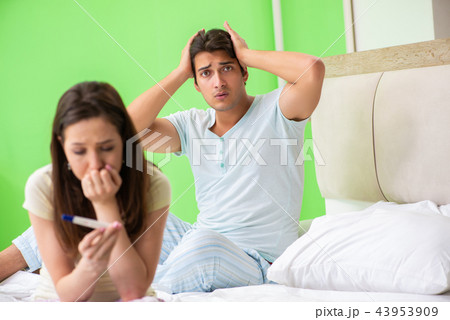 Young married woman with pregnancy results test 43953909