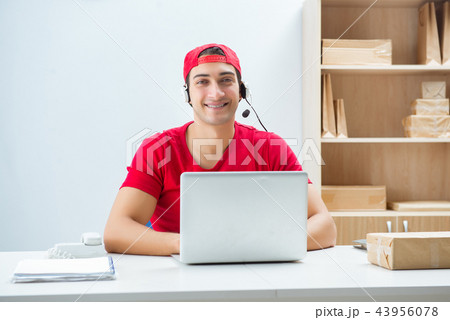 Call center worker at parcel distribution center in post office Call center worker at parcel distribution center in post office 43956078