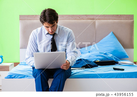 Businessman working in the hotel room Businessman working in the hotel room 43956155