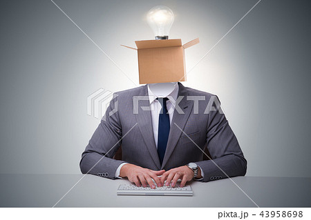 Businessman in thinking out of box concept Businessman in thinking out of box concept 43958698