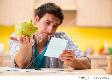 Young man husband in budget planning concept 43959605