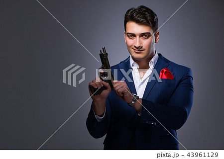 Handsome man against gray background 43961129