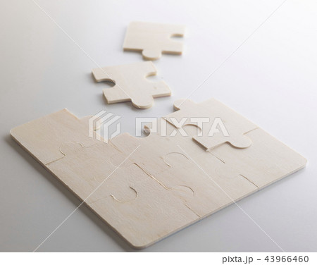 Last piece of wooden jigsaw is for business Last piece of wooden jigsaw is for business 43966460