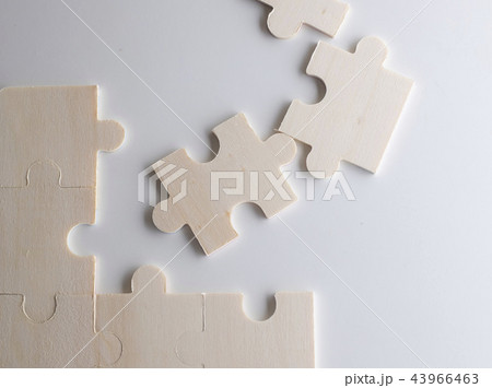 Last piece of wooden jigsaw is for business  43966463
