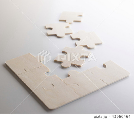 Last piece of wooden jigsaw is for business  43966464