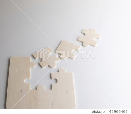 Last piece of wooden jigsaw is for business  43966465