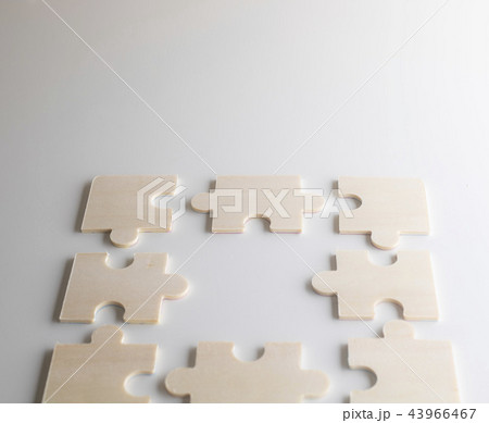 Last piece of wooden jigsaw is for business  43966467