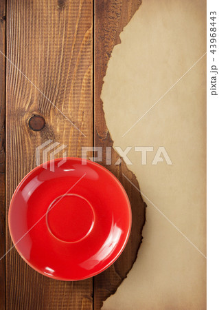 red saucer and old retro aged paper 43968443