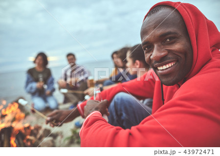 Man enjoying day off with his friends at the seaside 43972471