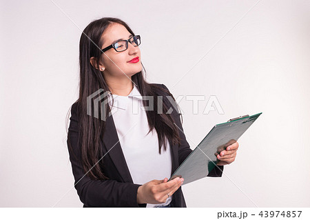 Business, work and people concept - Asian young woman holding a folder 43974857