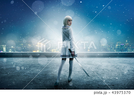 Anime girl on snowy edge of skyscraper roof 43975370