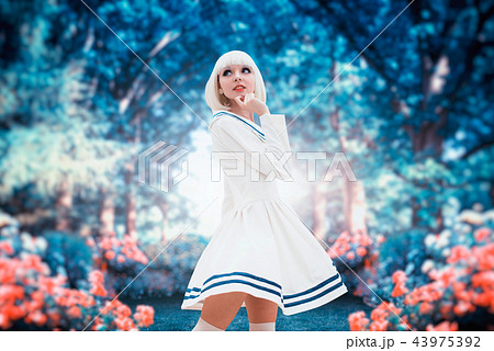 Anime style woman in park with cherry blossoms Anime style woman in park with cherry blossoms 43975392
