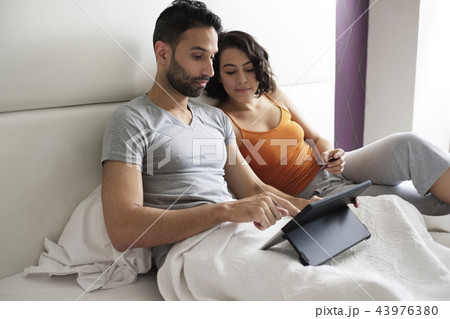 Young People In Bed Booking Holidays On Line Young People In Bed Booking Holidays On Line 43976380