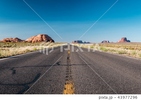 Empty scenic highway in Monument Valley Empty scenic highway in Monument Valley 43977296