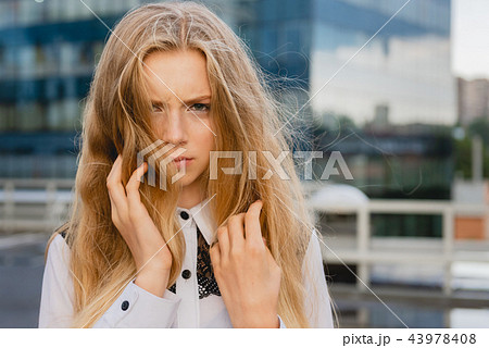 Young female at downtown background close up Young female at downtown background close up 43978408