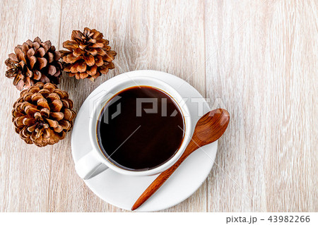 .A cup of coffee on a table .A cup of coffee on a table 43982266
