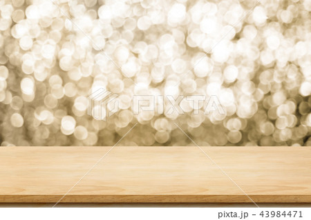 Empty old rustic wood table with sparkling gold 43984471