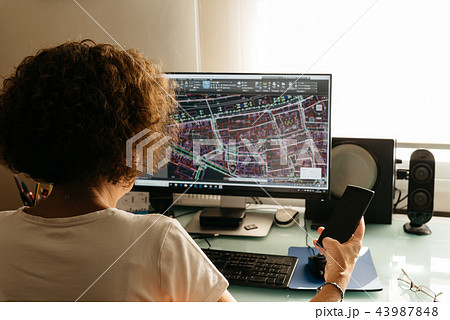 Architect drawing with cad software designing building 43987848