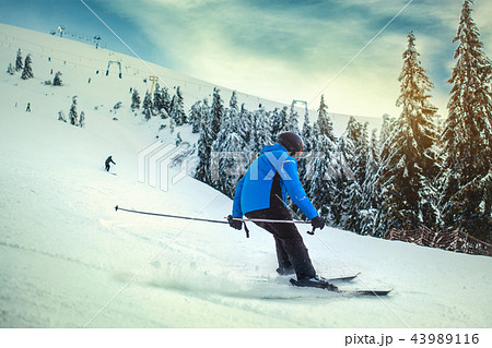 Man skier on a slope in the mountains 43989116