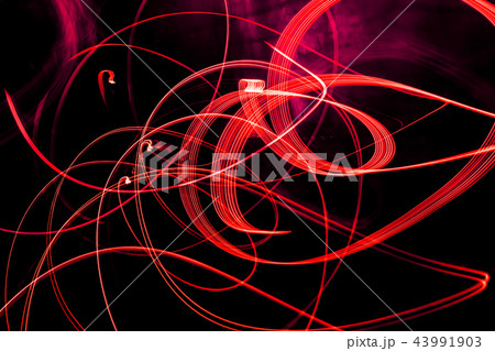 Bright red spiral patterns from light strips on a Bright red spiral patterns from light strips on a 43991903