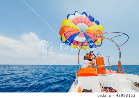 Parasailing water amusement - Stuff prepearing parachute to fly 43993152