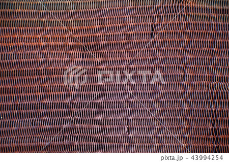 Texture of an old rusty metal mesh Texture of an old rusty metal mesh 43994254