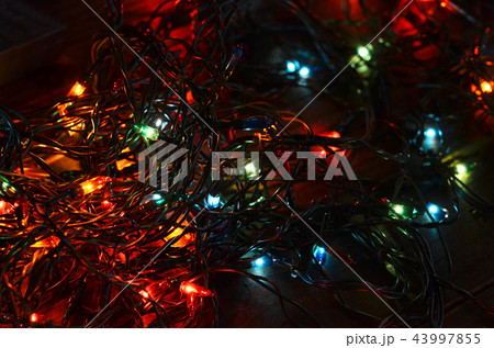 Christmas garland with lights on wooden background 43997855