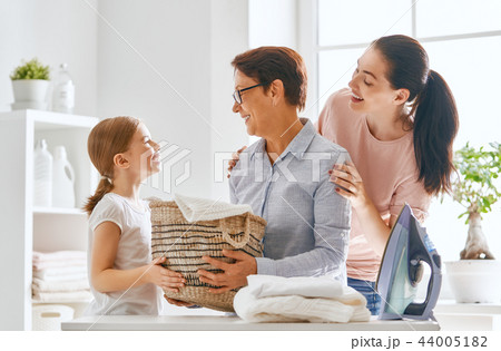 family doing laundry at home family doing laundry at home 44005182