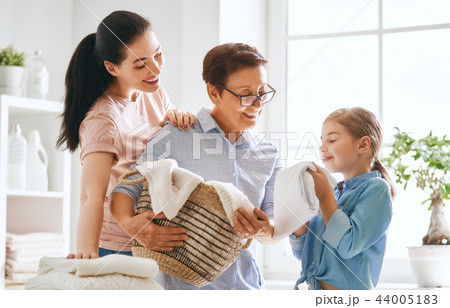 family doing laundry at home 44005183