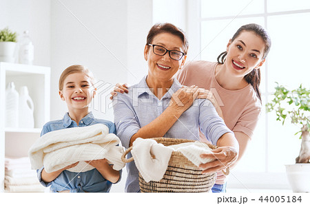 family doing laundry at home family doing laundry at home 44005184