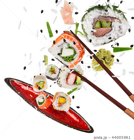 Pieces of delicious japanese sushi frozen in the air. 44005961