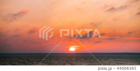 Sunrise Above Baltic Sea. Natural Sunrise Sky Warm Colors Over R 44006365