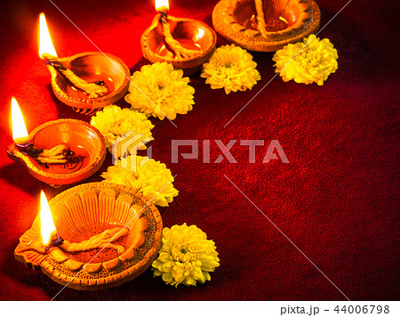 Clay diya lamps lit with flowers for Diwali Clay diya lamps lit with flowers for Diwali 44006798