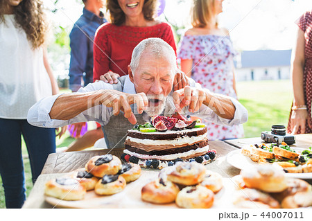 Family celebration or a garden party outside in the backyard. Family celebration or a garden party outside in the backyard. 44007011