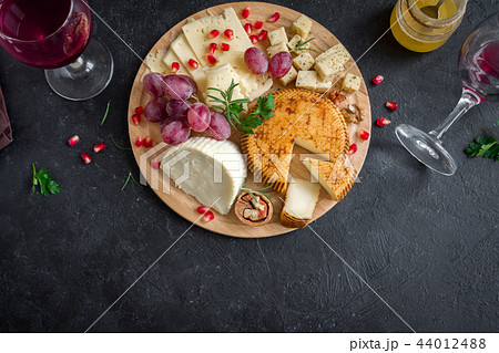 Cheese platter with fruits and wine Cheese platter with fruits and wine 44012488