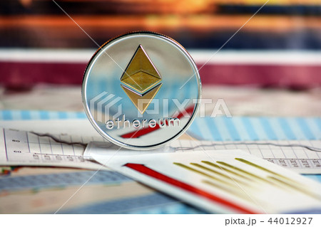 Ripple coin against of different banknotes  44012927