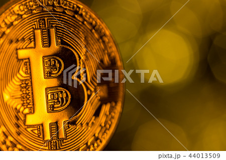 Bitcoin gold coins with defocused abstract background. Virtual cryptocurrency concept. Bitcoin gold coins with defocused abstract background. Virtual cryptocurrency concept. 44013509