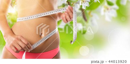 Woman with measure tape Woman with measure tape 44013920