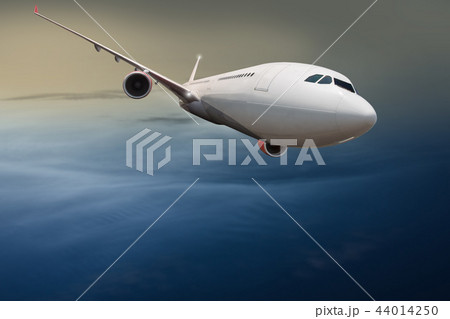 Commercial airplane flying above clouds. Commercial airplane flying above clouds. 44014250