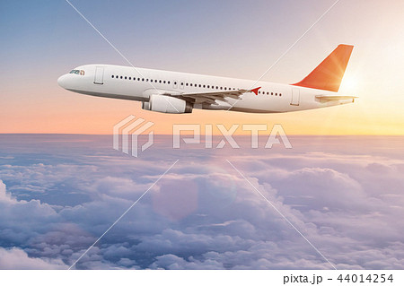 Commercial airplane flying above clouds. Commercial airplane flying above clouds. 44014254