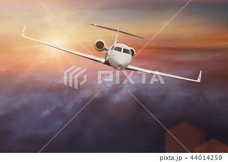 Commercial airplane flying above clouds. 44014259