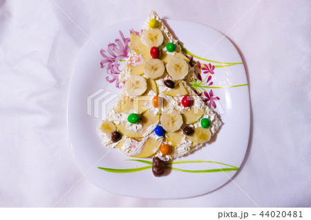 Children dessert with bananas and candy. 44020481