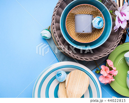 Tableware dish set on blue pastel background Tableware dish set on blue pastel background 44022815