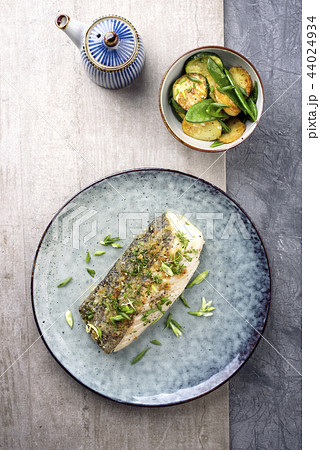 Fried cod fish fillet with vegetable 44024934