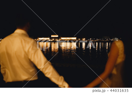 Luxury married wedding couple, bride and groom posing in luxury city Luxury married wedding couple, bride and groom posing in luxury city 44031635