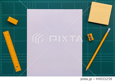 Stationery and white paper on cutting mat Stationery and white paper on cutting mat 44033256