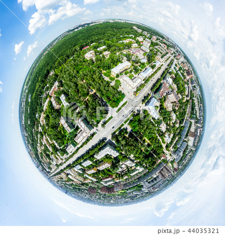 Aerial city view with crossroads and roads, houses, buildings, parks and parking lots. Sunny summer Aerial city view with crossroads and roads, houses, buildings, parks and parking lots. Sunny summer 44035321