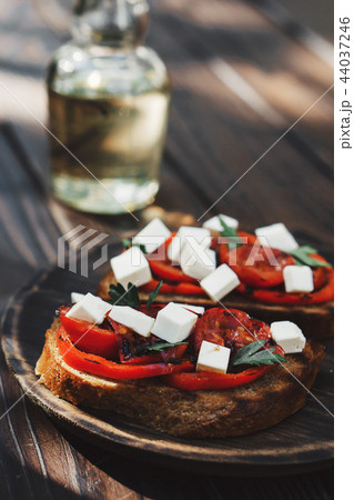 rye bruschettas with grilled tomatoes and feta rye bruschettas with grilled tomatoes and feta 44037246