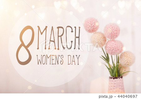 Flowers composition for Women's Day. Pink flowers on old white wooden background. Flowers composition for Women's Day. Pink flowers on old white wooden background. 44040697