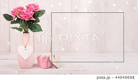 Flowers composition for Valentine's, Mother's or Women's Day. Pink flowers on old white wooden background. 44040698